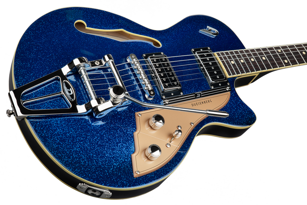 Duesenberg Starplayer TV electric guitar in blue sparkle finish, showcasing its sleek body and vintage-style pickups.