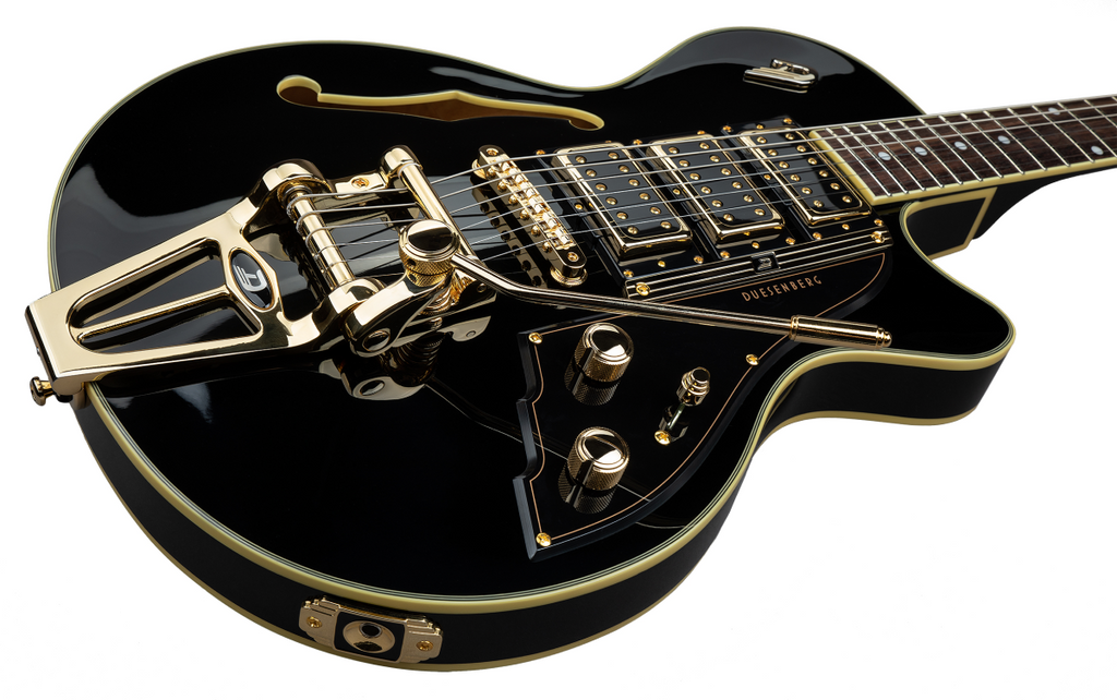 Black Duesenberg Starplayer TV Custom electric guitar with three pickups and chrome hardware, shown from a front angle.