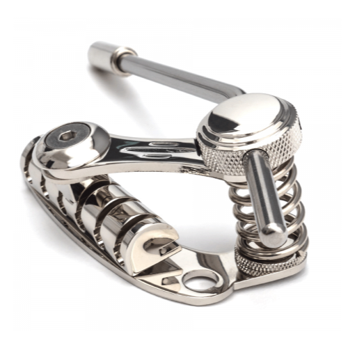 Duesenberg Les Trem II Nickel guitar tremolo bridge with six mounting screws and detailed nickel finish on a guitar.