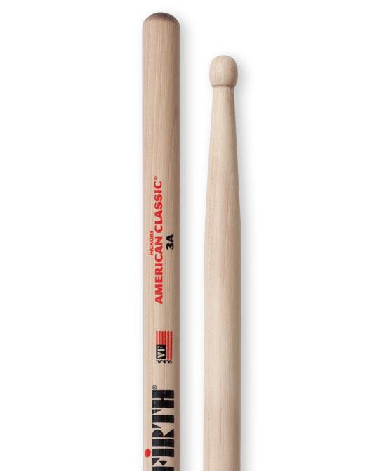 Vic Firth American Classic 3A wood tip drumsticks laid out, showing their light wood finish and size suitable for drum playing.