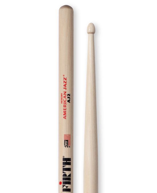 Vic Firth American Jazz AJ2 wood tip drumsticks laid out, showing their smooth finish and tapered design for jazz drumming.
