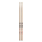 Vic Firth American Classic Metal Wood Tip Drumsticks laid out, showcasing their sturdy design and natural wood tips for drumming.