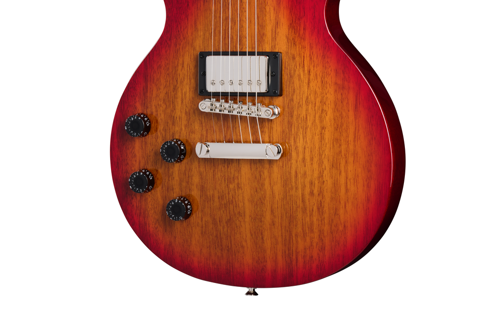 Electric guitar with Hetg Cherry Sunburst finish, Epiphone Les Paul Tribute model, left-handed, showcasing the instrument's body and hardware.