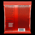 Ernie Ball Paradigm Slinky 7-string electric guitar strings in 10-62 gauge, shown on a guitar with black and silver packaging.