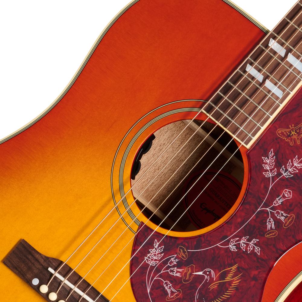 Epiphone Hummingbird Standard acoustic guitar in cherry sunburst finish, showing the body and detailed pickguard design.