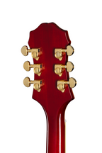 Left-handed Epiphone Broadway electric guitar in wine red with chrome hardware and classic design, shown resting on a stand.