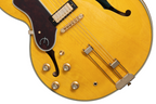 Left-handed Epiphone Sheraton Frequensator electric guitar in natural finish, featuring dual humbuckers and classic design details.