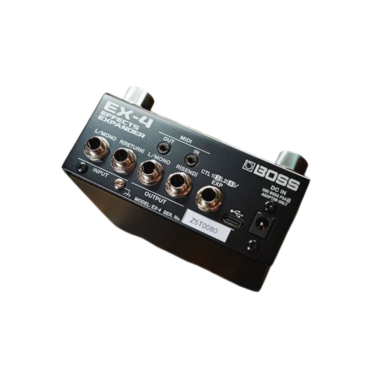 BOSS EX4 Effects Expander Pedal with multiple control knobs and input/output jacks for guitar effects processing.