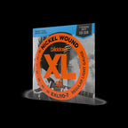 D'Addario EXL110-7 10-59 regular light 7-string electric guitar strings coiled on a white background.