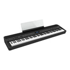 Roland FP-90X portable digital piano in black, showing the sleek keyboard and control panel on a white background.