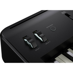 Black Roland FP-E50 entertainment piano with keys and control panel, perfect for stage and performance use.