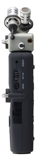 Zoom H5 Handy Recorder digital recorder with multiple input ports and compact design, shown with attached microphones.