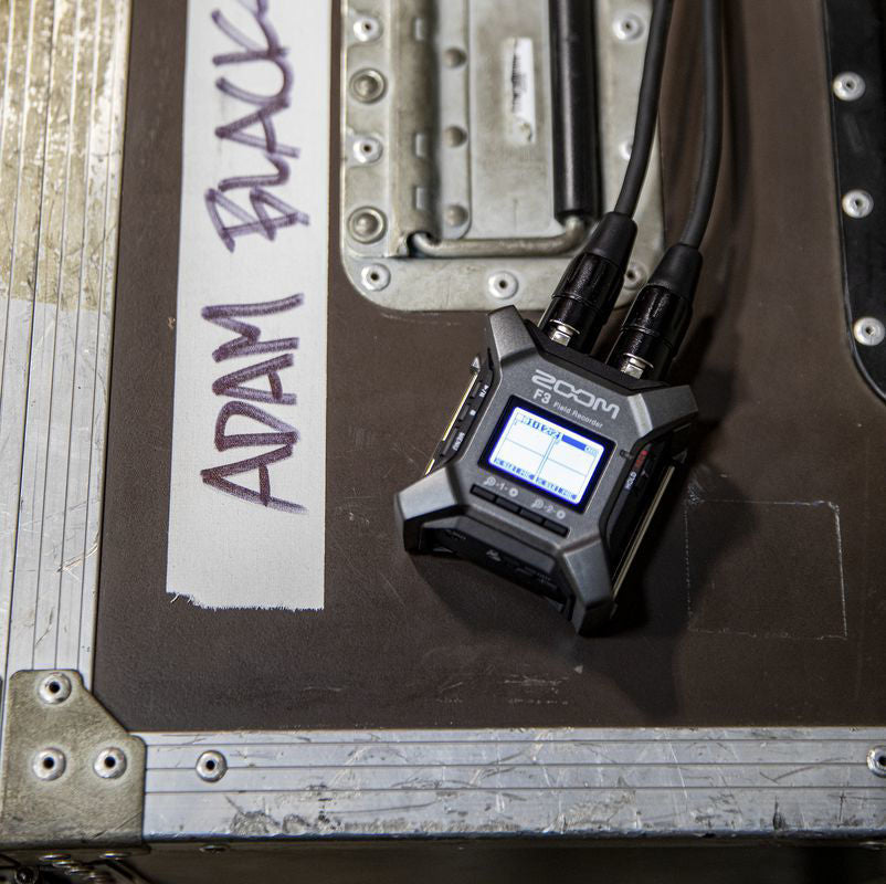 Zoom F3 32-bit field recorder showing front view with control buttons and display screen for professional digital audio recording.