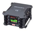 Zoom F6 digital field recorder with multiple input options and professional audio controls, shown in a close-up view.