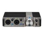 Zoom UAC-2 USB 3.0 audio converter interface with input and output ports for high-quality audio recording and streaming.