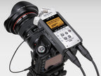 Zoom HS-1 hotshoe mount for digital recorder accessories, shown attached to a camera's hotshoe with connection ports visible
