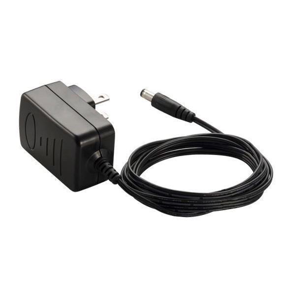 Zoom AD-16 power supply adaptor for digital recorders, shown connected to a Zoom device in a close-up shot.