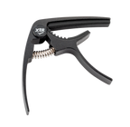 Black XTR GPX4CB trigger-style guitar capo on a guitar neck, showing its ergonomic design and secure clamp mechanism.