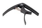 Black XTR GPX4CB Trigger Style Guitar Capo attached to a guitar neck, showcasing its quick-release mechanism and sleek design.