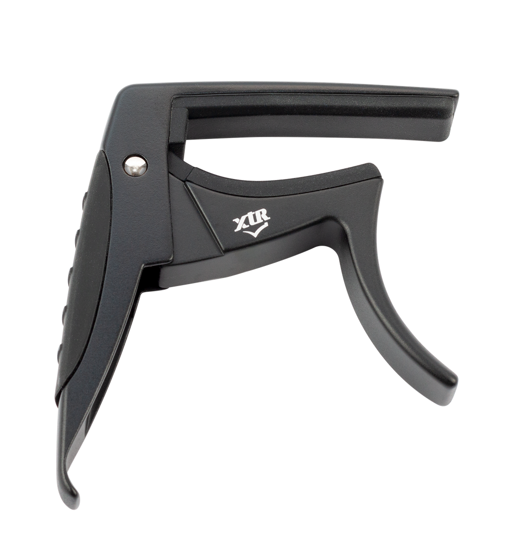 Black XTR Trigger Style Acoustic Guitar Capo resting on a guitar neck, showcasing its ergonomic design and secure clamp mechanism.