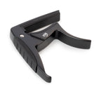 Black XTR Trigger Style Acoustic Guitar Capo clipped onto the neck of a guitar, showing its design and clamp mechanism.