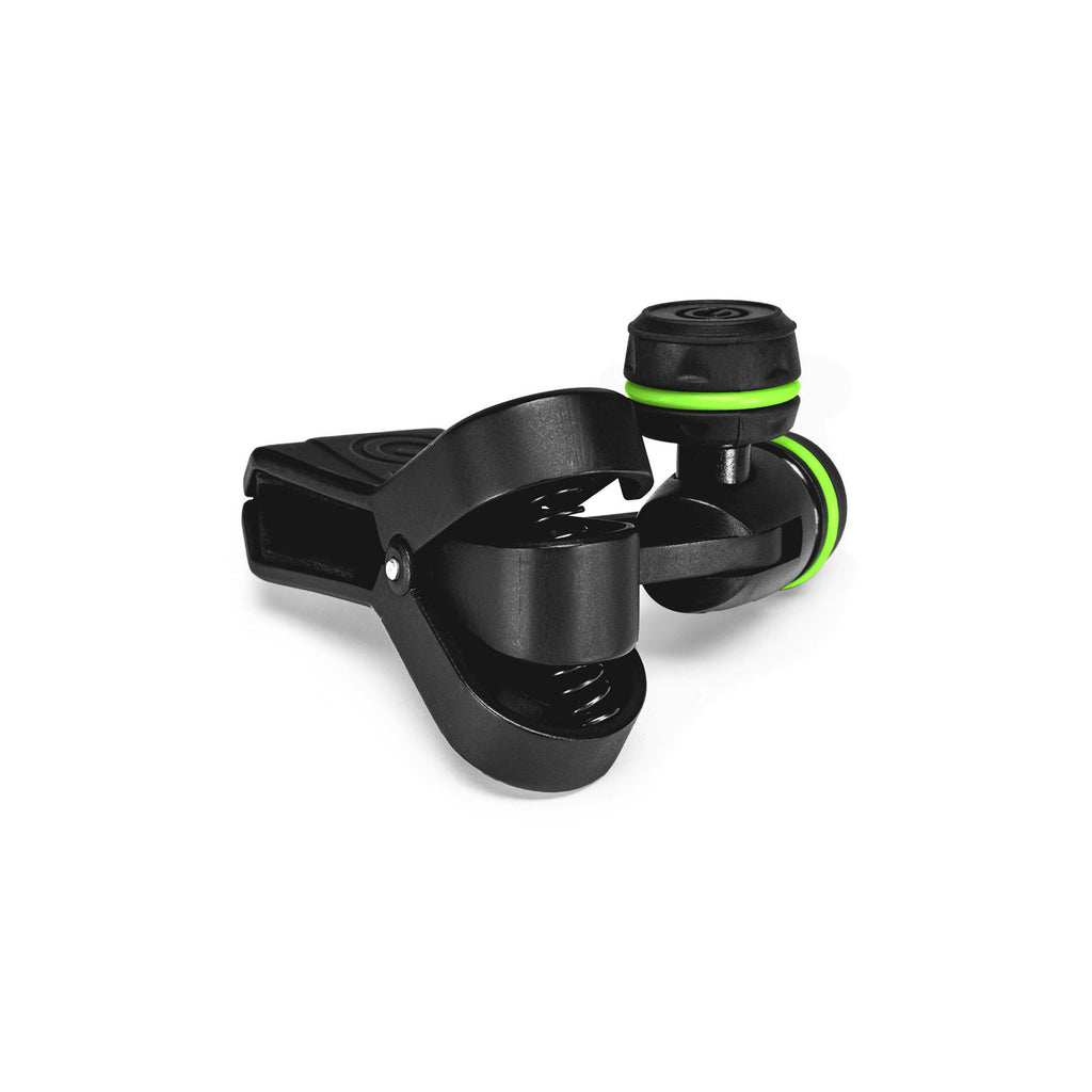 Gravity MSUCLMP universal adjustable microphone clip for stands, showing the flexible, secure grip on a microphone in a studio setting.