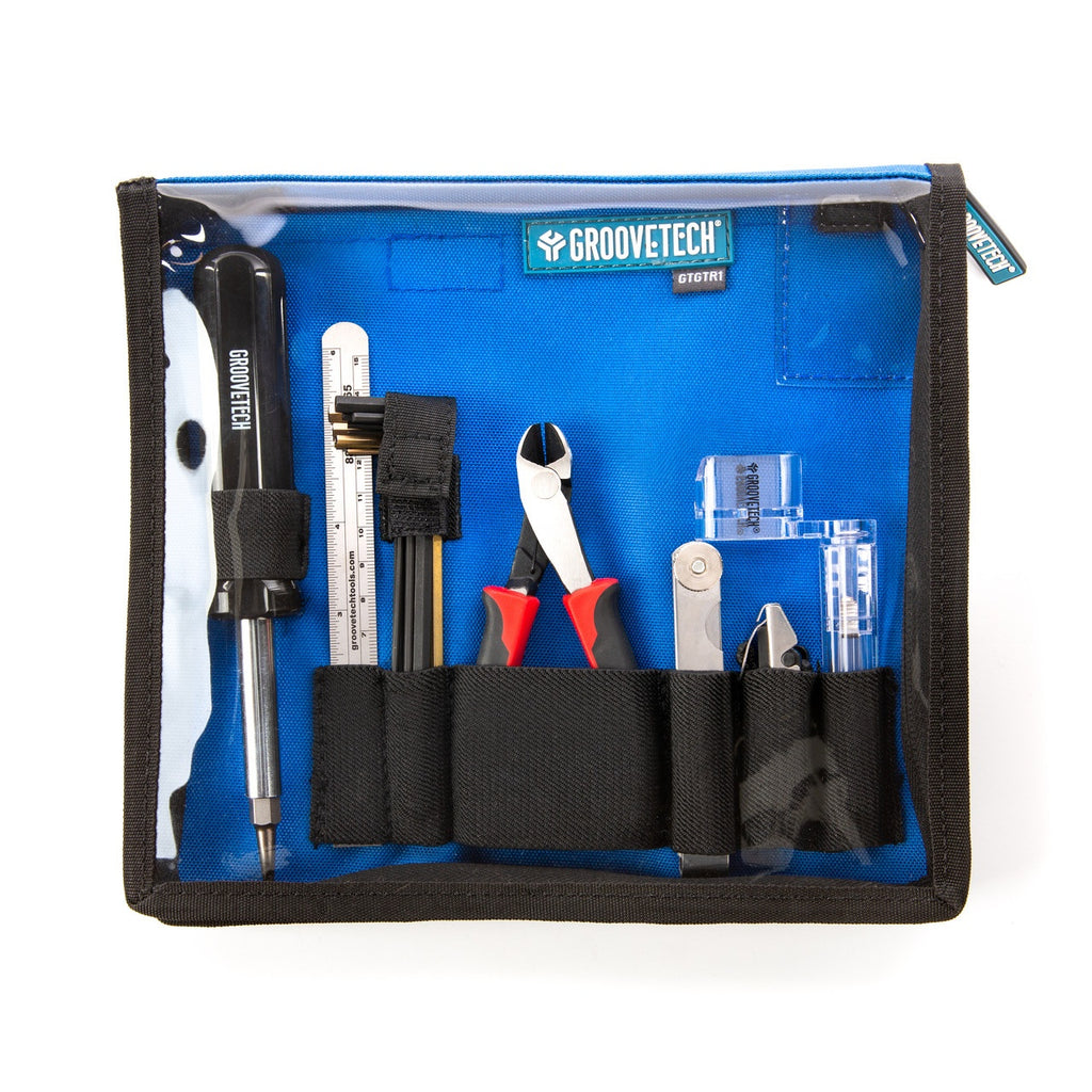 Groovetech Guitar Player Tech Kit with various guitar accessories, including tools and replacement parts for maintenance.