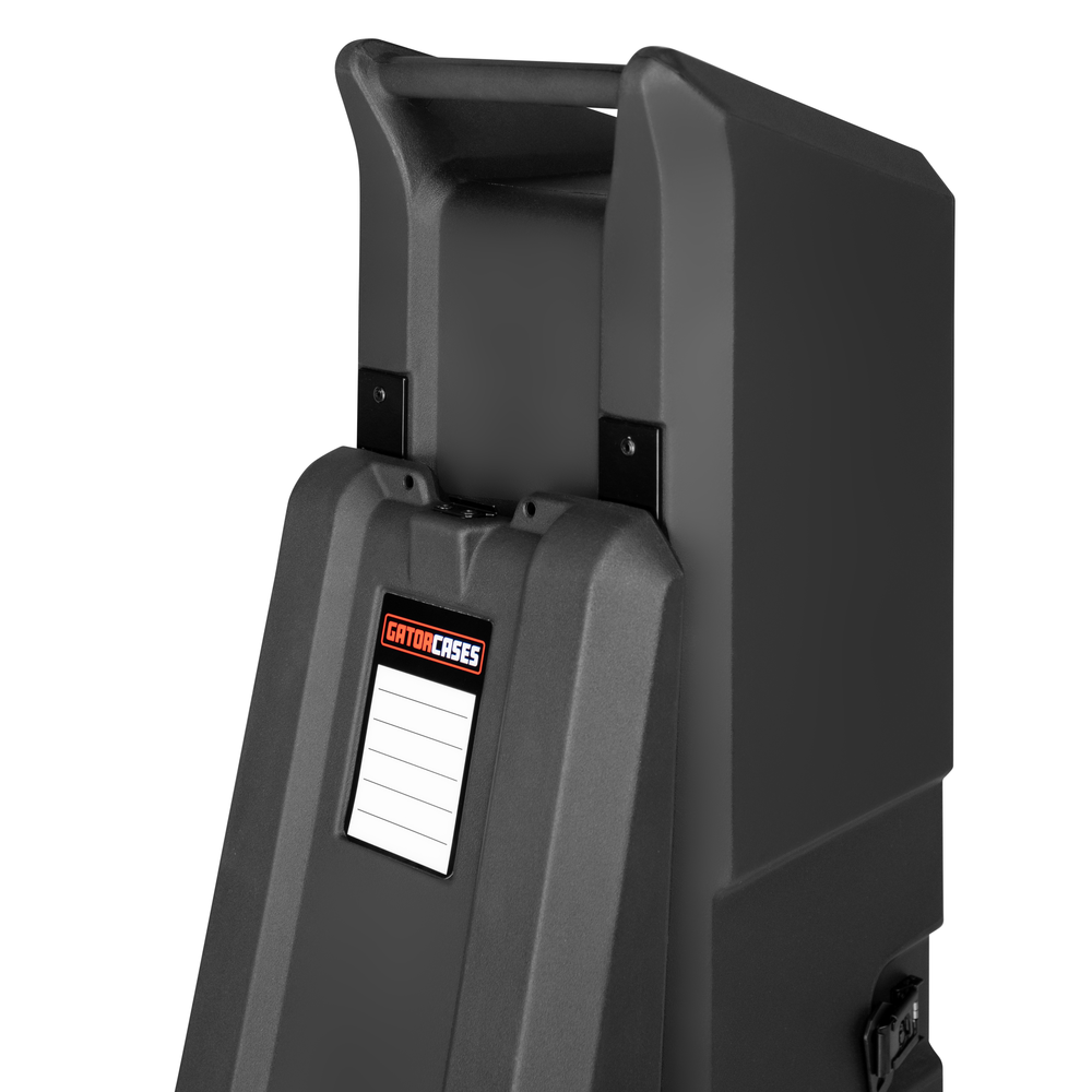 GATOR GTRMINIVAULTB2 roto-molded mini bass guitar vault case with padded interior and secure latches for protection.
