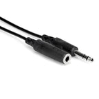 Hosa HPE-310 10ft 1/4 inch TRS headphone extension cable connected to audio equipment, showing sturdy connectors and cable.