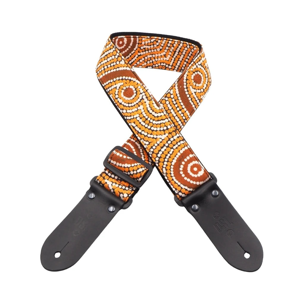 Black DSL Straps Goanna Dreaming guitar strap, 2-inch wide, featuring intricate goanna design and durable leather ends.