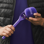Purple Rode Interview GO handheld adaptor for Wireless GO mic system, shown with microphone attachment and connecting parts.