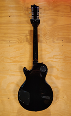 Black Jet JL-500 LP style electric guitar from Jet Guitars with a sleek body and six strings, perfect for rock and blues performances.
