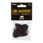 Six Jim Dunlop Ultex Jazz III guitar picks in the Players Pack, showcasing the compact, pointed design of these Dunlop guitar accessories.