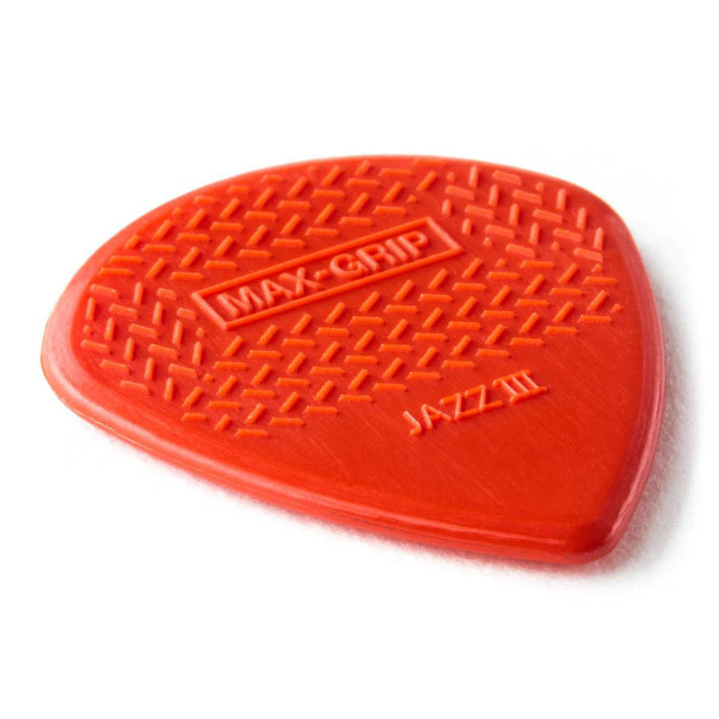 Six Jim Dunlop Nylon Jazz III Max Grip guitar picks in red, displayed in a pack, designed for precise and comfortable playing.