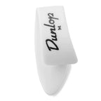 Four white Jim Dunlop medium thumb picks for guitar playing, shown in a pack with four picks visible.