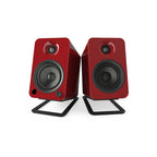 Black Kanto KANS4 medium desk top tilted speaker stands for studio monitors, designed to improve sound clarity and desk organization.