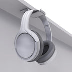 White Kanto under-desk headphone hanger mounted on a desk, designed to hold headphones securely and keep workspace organized.