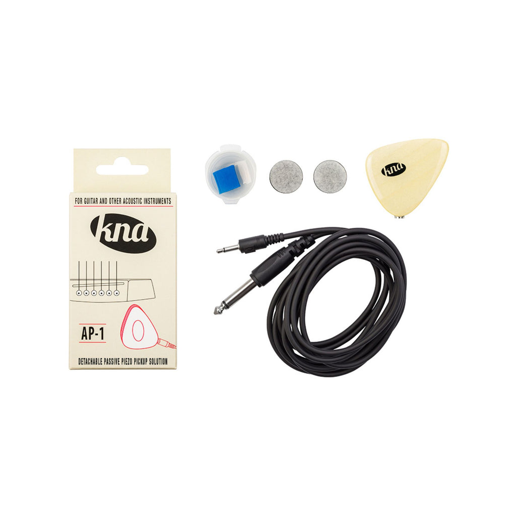 KNA AP-1 Piezo pickup attached to an acoustic guitar, showcasing the compact, transparent design for natural sound amplification.