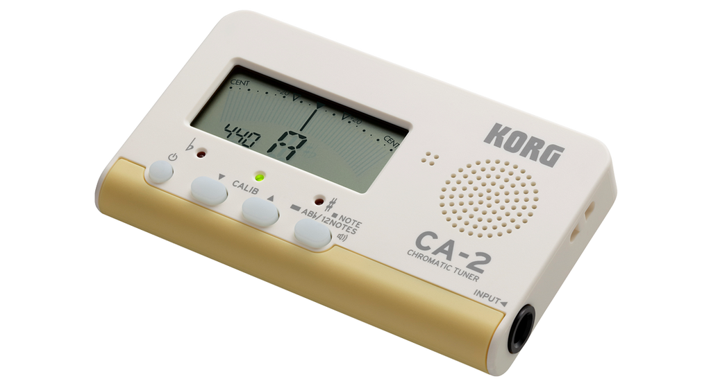 Korg CA2 chromatic tuner displaying a clear LCD screen with tuning indicators for precise guitar tuning.