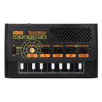 Korg Monotron Delay analog ribbon synthesizer featuring delay effect, compact design with controls and connectors visible.