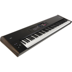 Korg Nautilus AT 88-key music workstation with aftertouch, featuring a sleek black design and control panel with display.