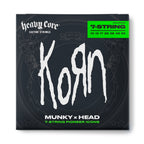Jim Dunlop Korn Heavy Core 7-string electric guitar strings 10-65 pack, featuring durable construction and high-quality metal for powerful sound.