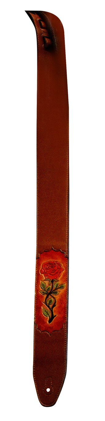 Brown Xtreme XTR 2.5 padded leather guitar strap with carved rose inlay, showing detailed craftsmanship and comfortable padding.