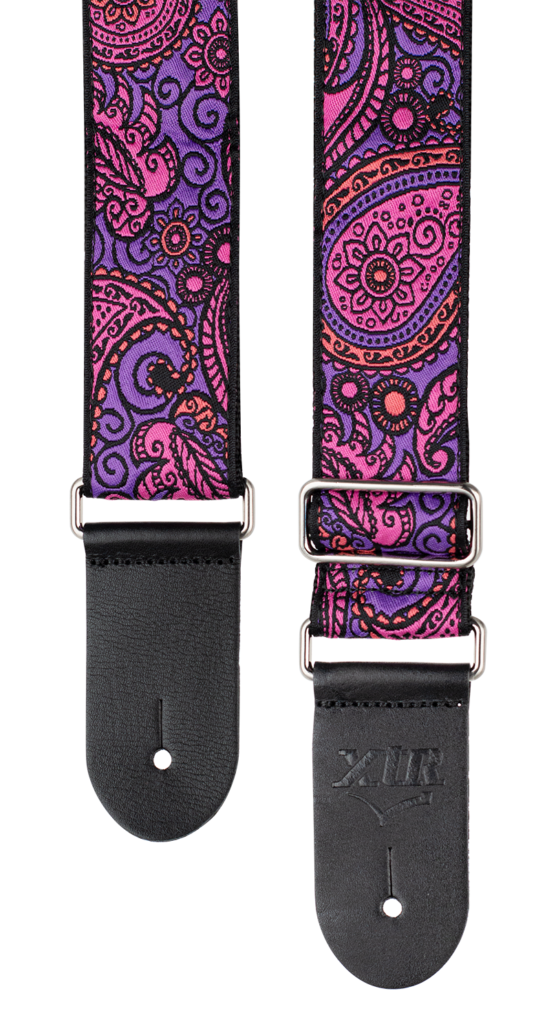 XTR Deluxe woven jacquard guitar strap with paisley purple and pink pattern, featuring poly cotton material and adjustable strap design.