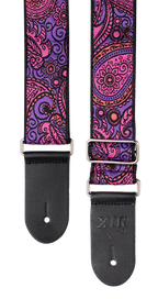 XTR Deluxe woven jacquard guitar strap with paisley purple and pink pattern, featuring poly cotton material and adjustable strap design.
