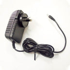 Yamaha 12V620 power supply adaptor for keyboards, compact black Yamaha keyboard power supply with cable connection.