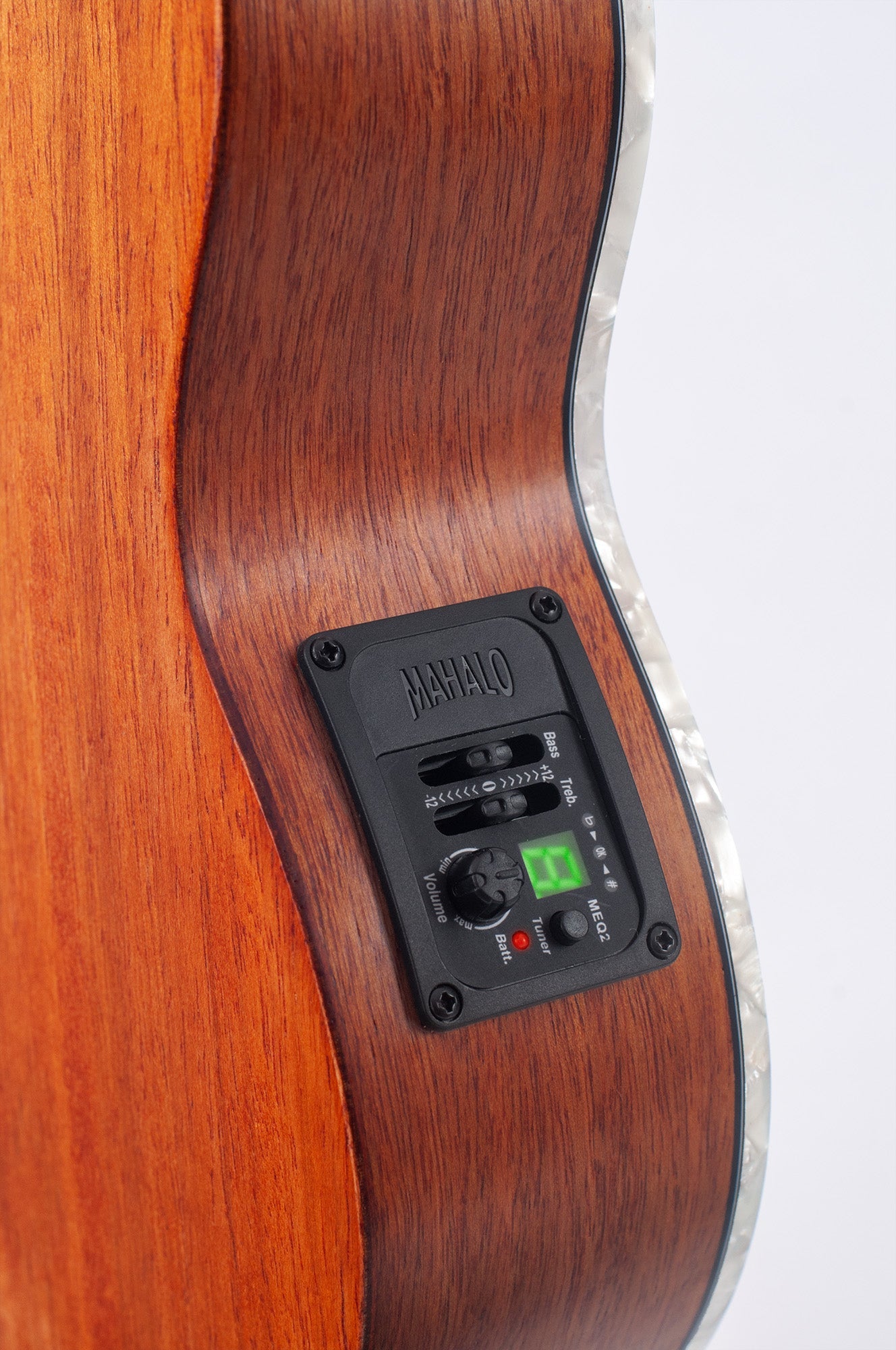 Mahalo ukulele pickup and EQ device shown from the side, designed for amplifying and equalizing ukulele sound.