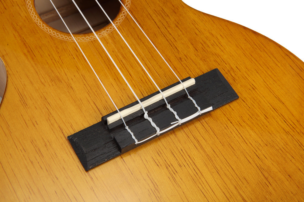 Mahalo Hano Series MH3 teno ukulele in vintage natural finish, showing the bridge and body details.