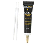 Music Nomad MN106 Tune It Lubricant for guitar tuning and maintenance, shown in a small bottle with a white cap.