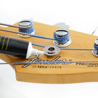 Music Nomad MN106 Tune It Lubricant for guitar tuning keys, in a small bottle with a black cap, designed for guitar maintenance.